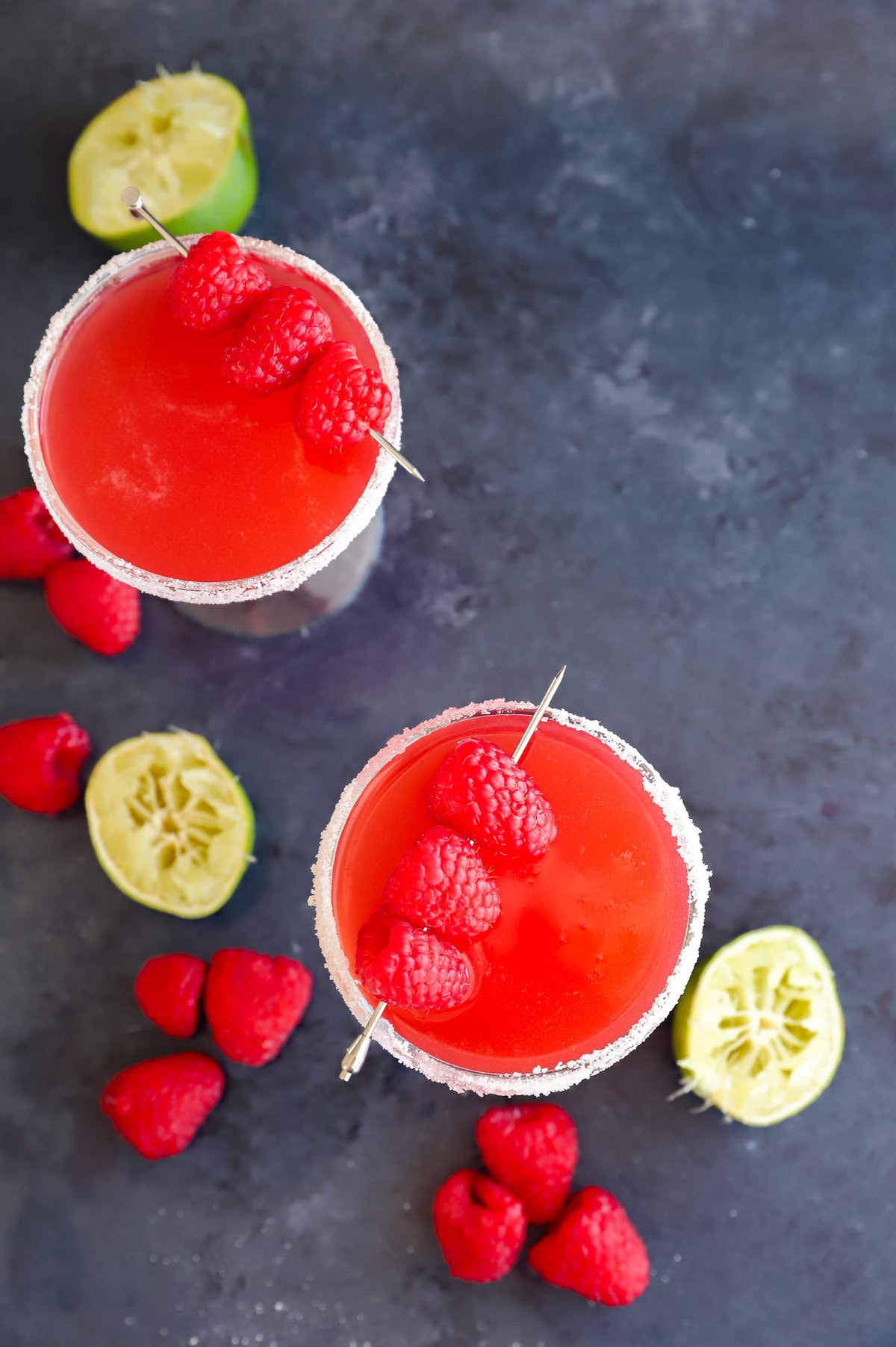 Fresh Raspberry Daiquiri 6 Close-up of a raspberry daiquiri in a coupe glass with a sugared rim, garnished with fresh raspberries