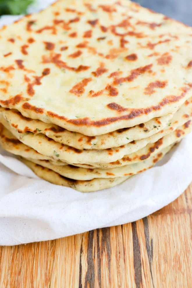 Turkish bread in a pile on towel image