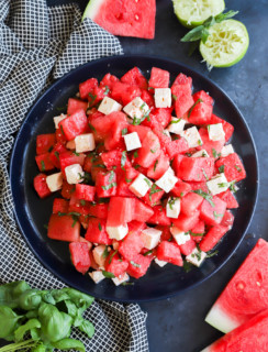 Picture of a fruit salad with cheese on a serving platter for summer