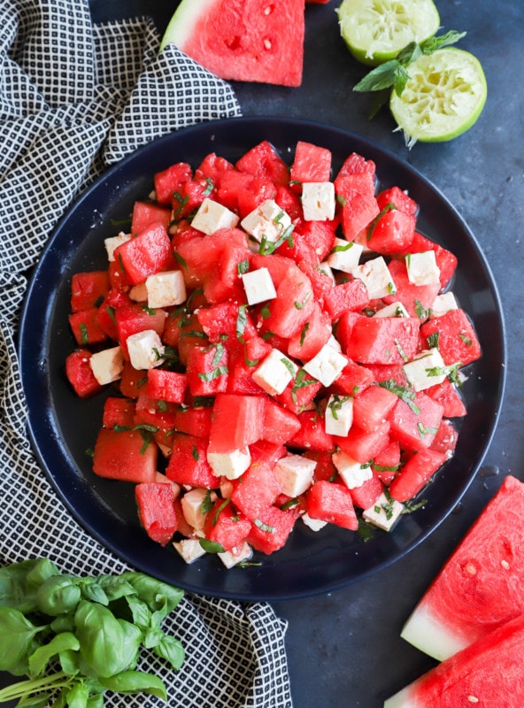 Picture of a fruit salad with cheese on a serving platter for summer