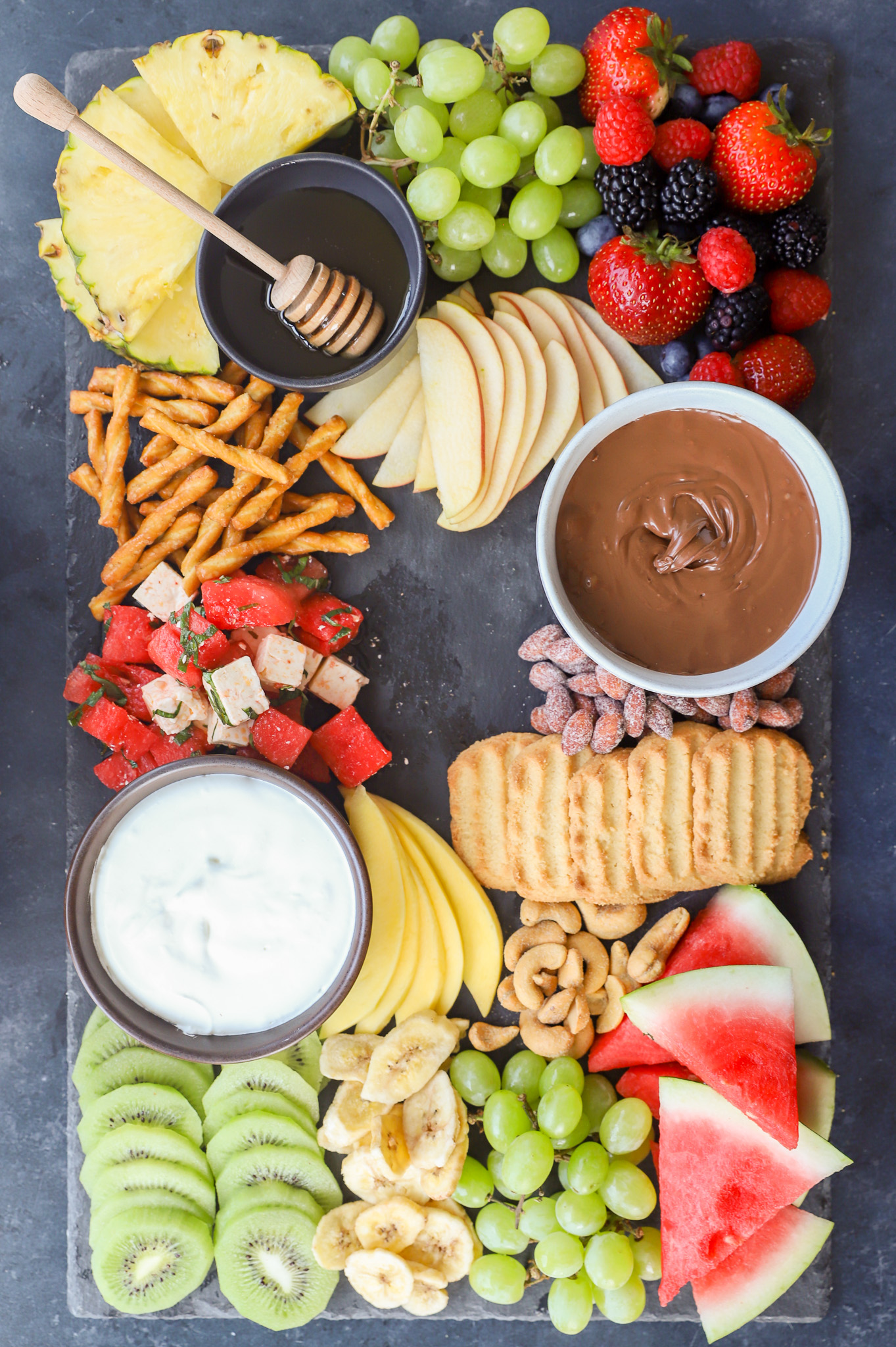 Ingredients for a fruit charcuterie board on display