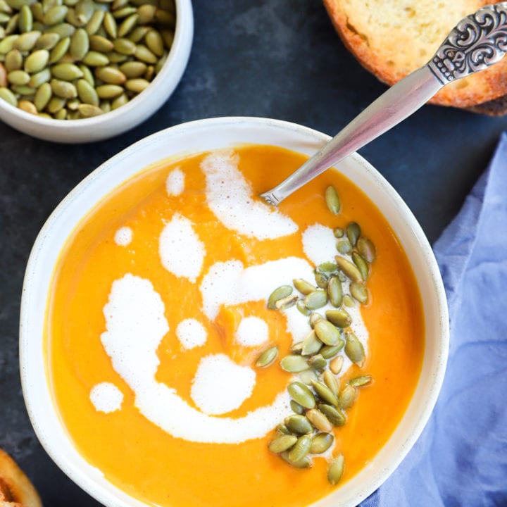 Picture of fall soup in bowl with bread and seeds