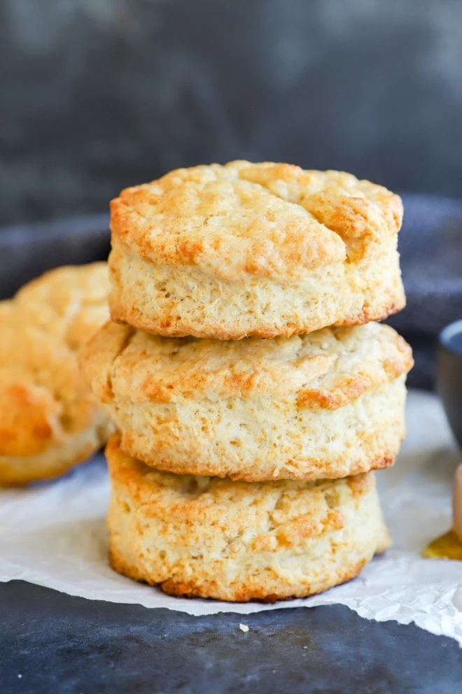 stack of buttery bread on parchment paper