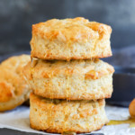 honey butter biscuits in a stack drizzled with honey