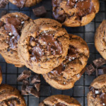 dark chocolate coffee cookies with sea salt on a baking sheet
