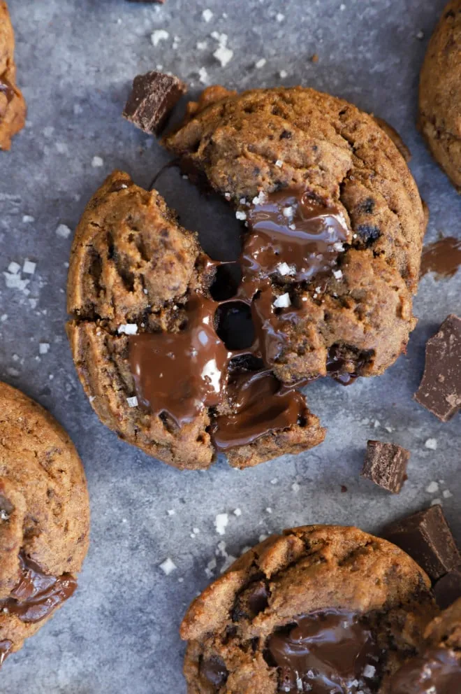 Pulling apart a gooey chocolate cookie with salt and espresso