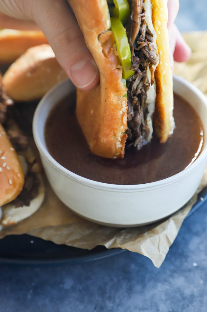 dipping a french dip in sauce