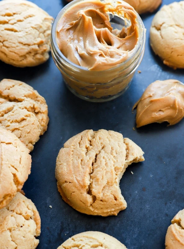 Chewy peanut butter cookies with peanut butter in a jar