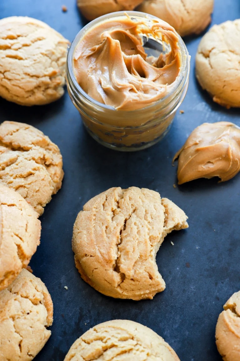 Chewy peanut butter cookies with peanut butter in a jar