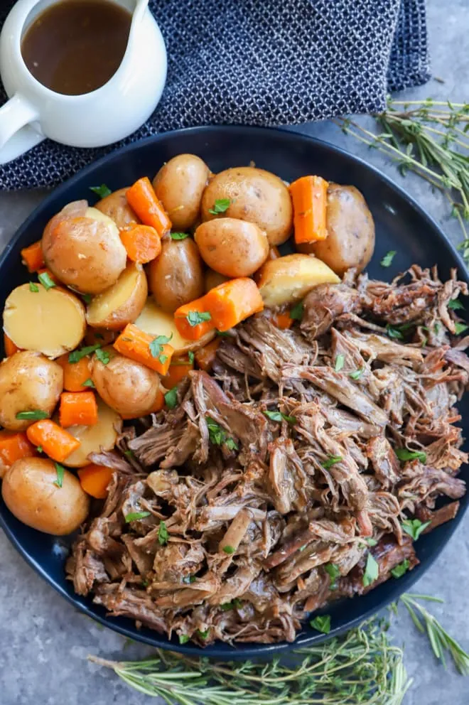 Plate of instant pot pot roast with vegetables and gravy