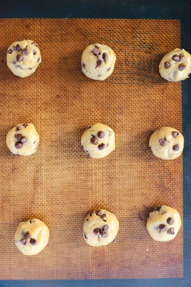 Mini dough balls for cookies on baking sheets