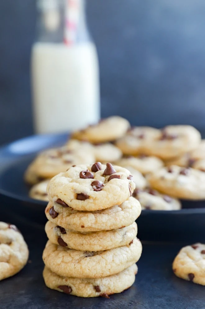 Stack of cookies with milk in the background