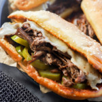 Image of a beef sandwich with hot peppers and cheese