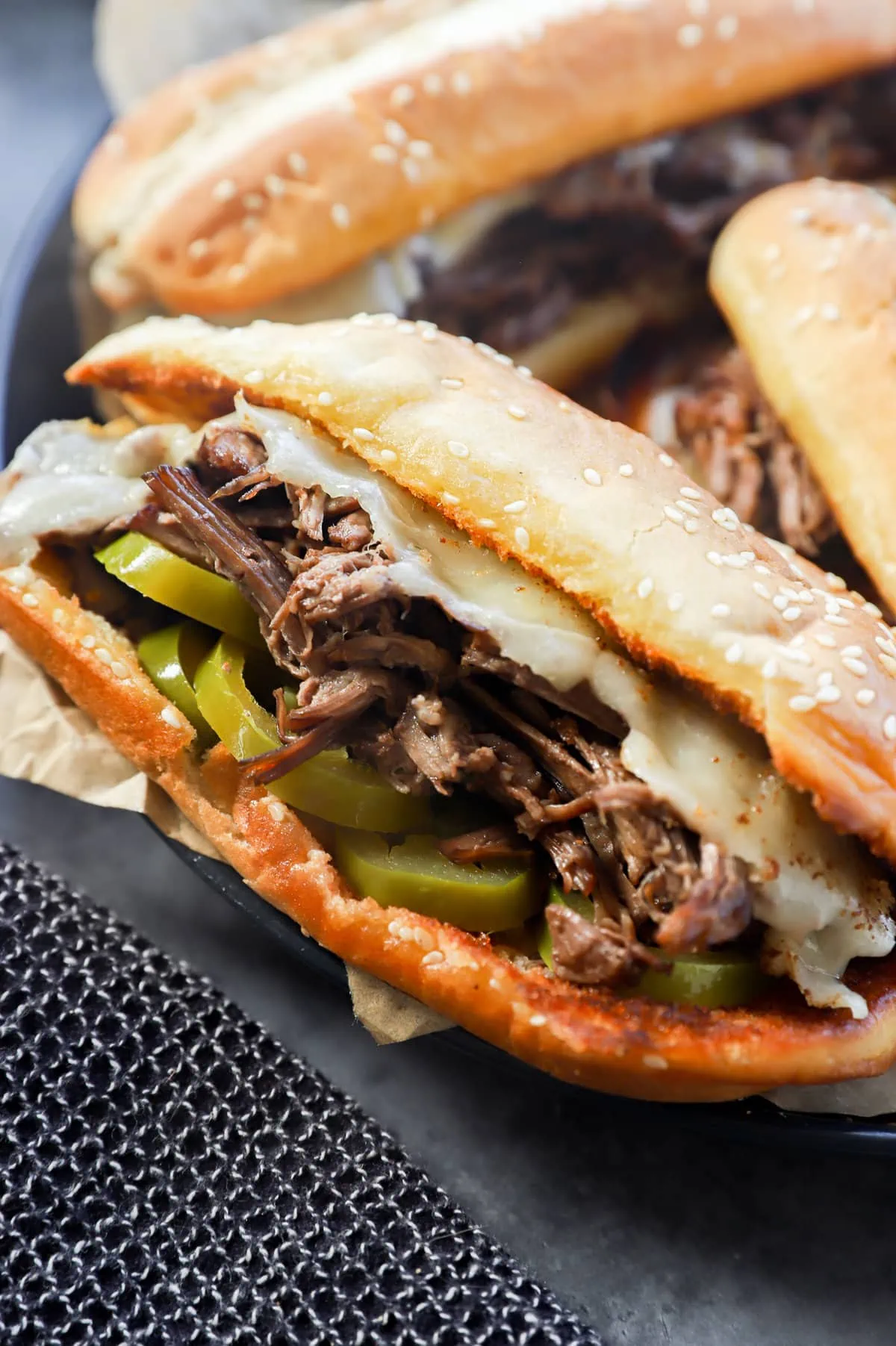 Image of a beef sandwich with hot peppers and cheese