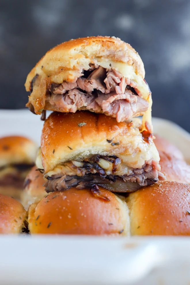 roast beef sliders on top of a baking dish