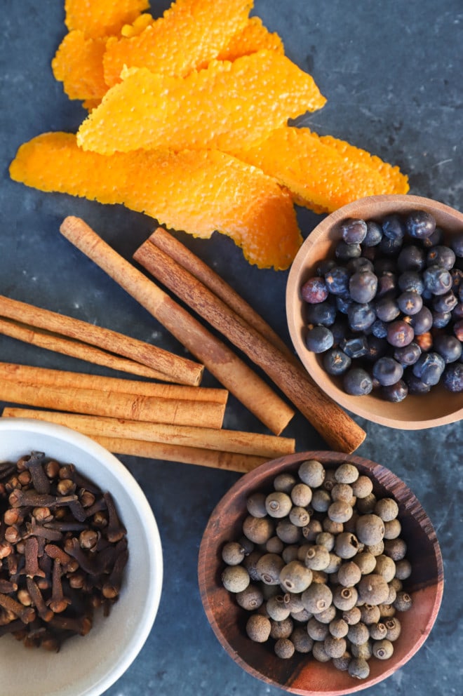 allspice berries, juniper berries, whole cloves, cinnamon sticks, and orange peels