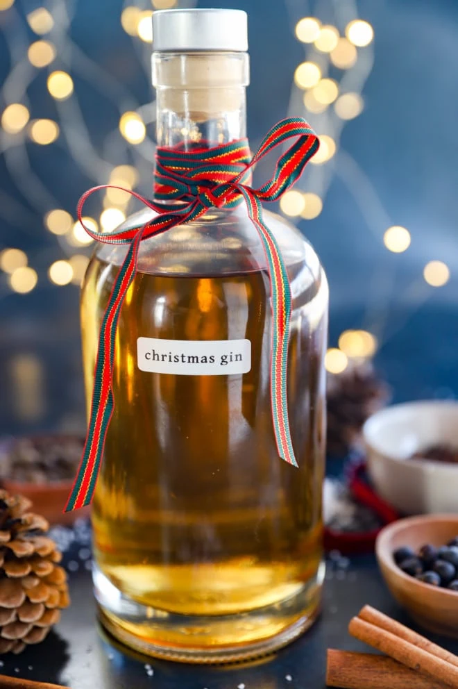 Christmas gin in a bottle with a label and a holiday bow