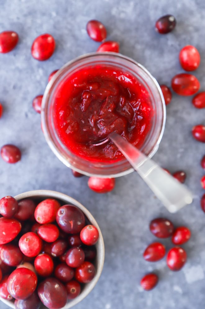 fruit jelly in a jar with a spoon