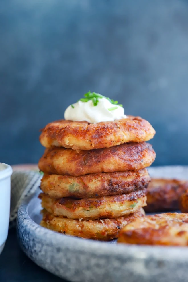 Big stack of pancakes with scallions and chives
