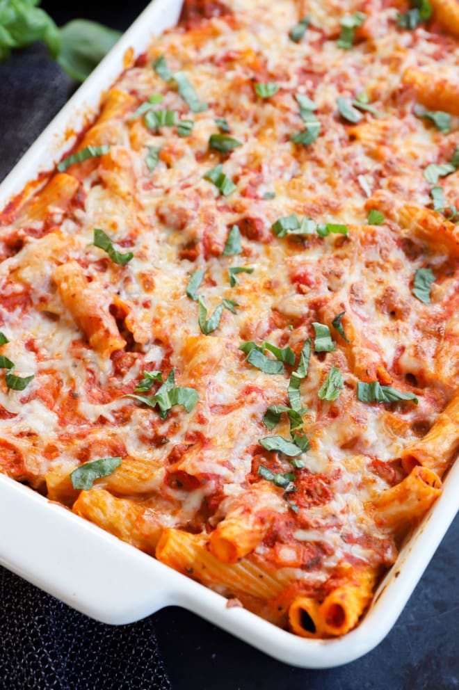 Fresh basil on top of a baked pasta dish