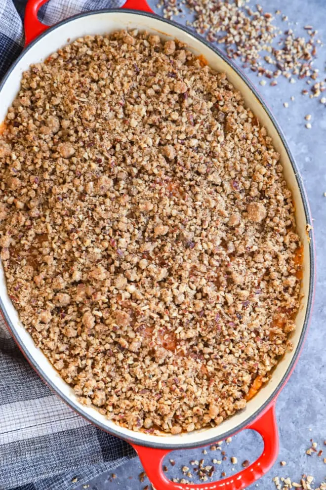 Pecan streusel topping on Thanksgiving side dish in baking pan