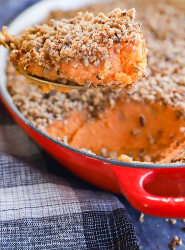 sweet potato souffle in baking pan with spoon