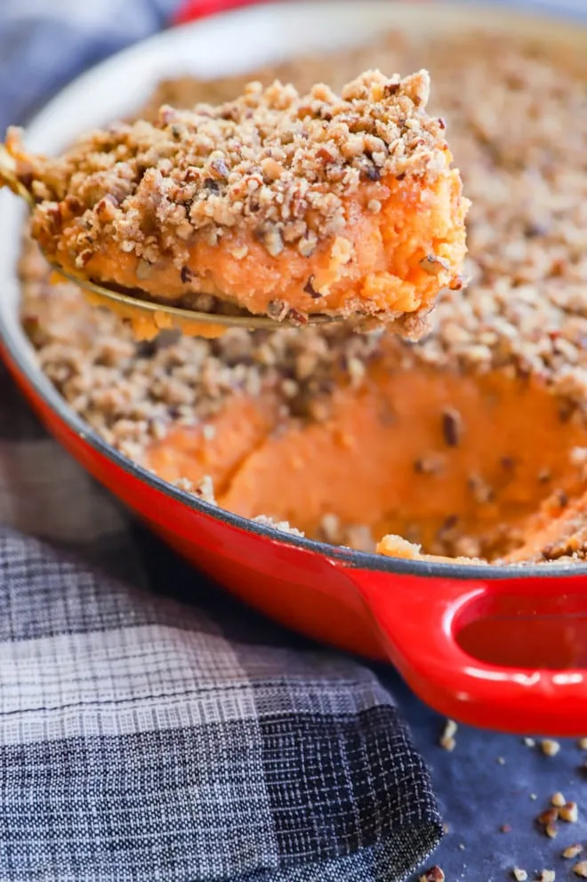 sweet potato souffle in baking pan with spoon