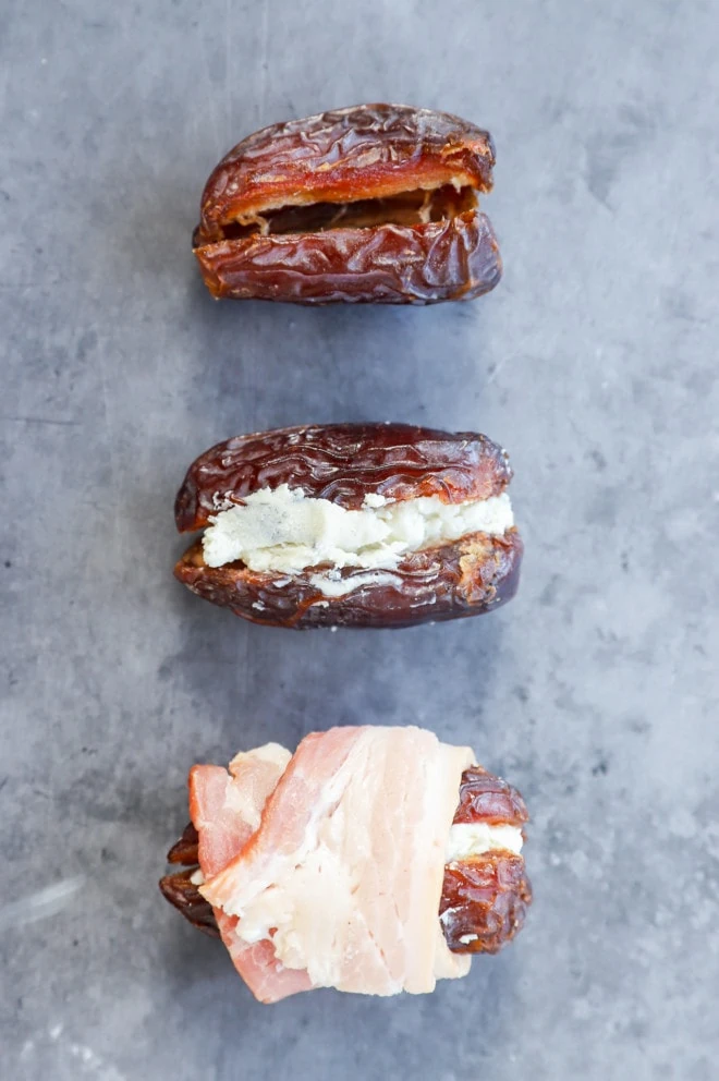 preparing bacon wrapped dates stuffed with goat cheese and fresh herbs