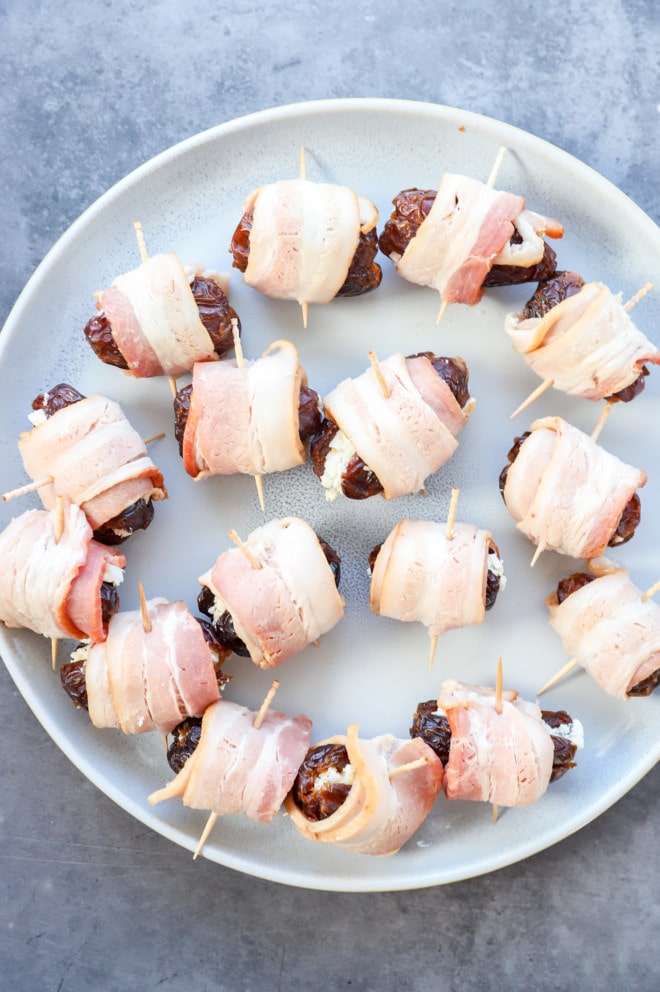 easy appetizer wrapped in pork on a plate before cooking