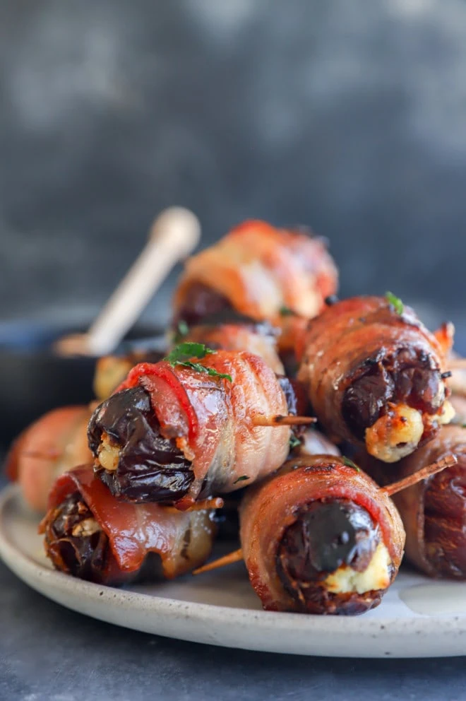 Plate of pork and dried fruit stuffed with goat cheese and drizzled with honey