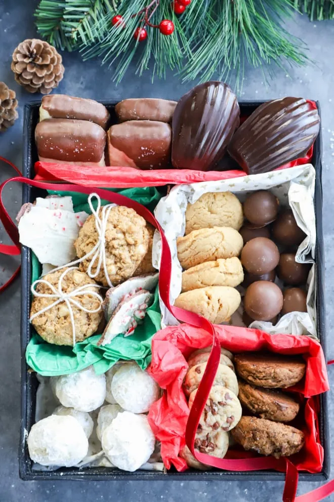 Christmas cookies in a box with ribbon and tissue paper
