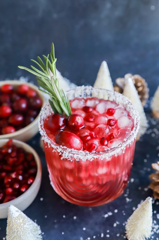 Christmas margarita in a glass with rosemary sprig