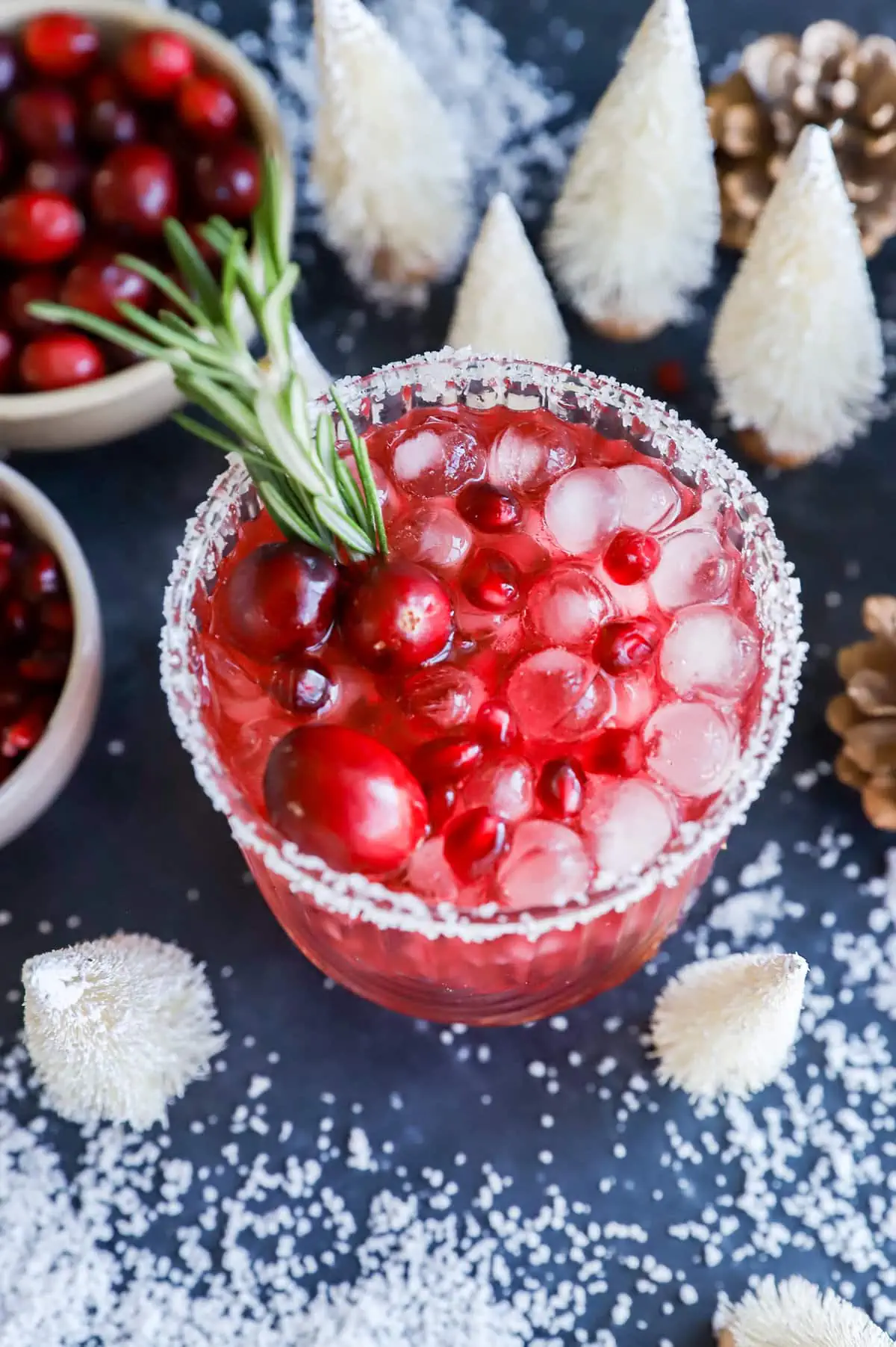 Glass of a holiday cocktail with festive decorations