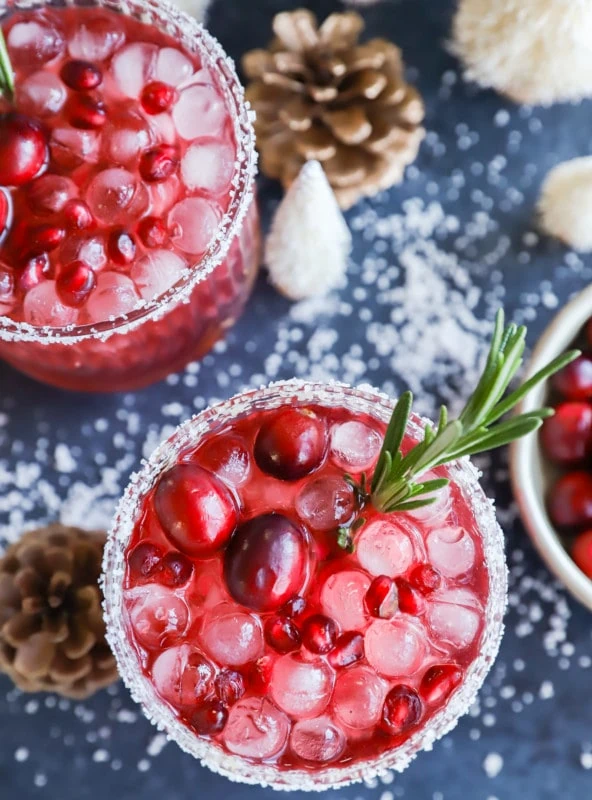 Pomegranate cocktail over ice with rosemary