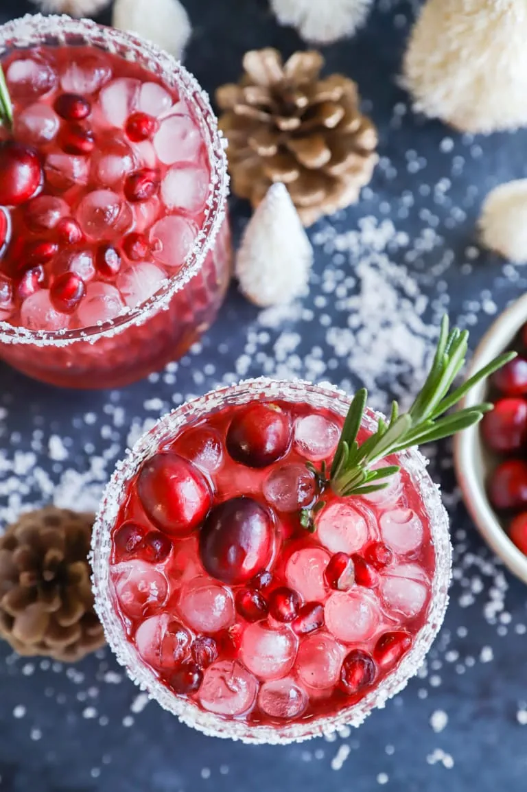 Pomegranate cocktail over ice with rosemary