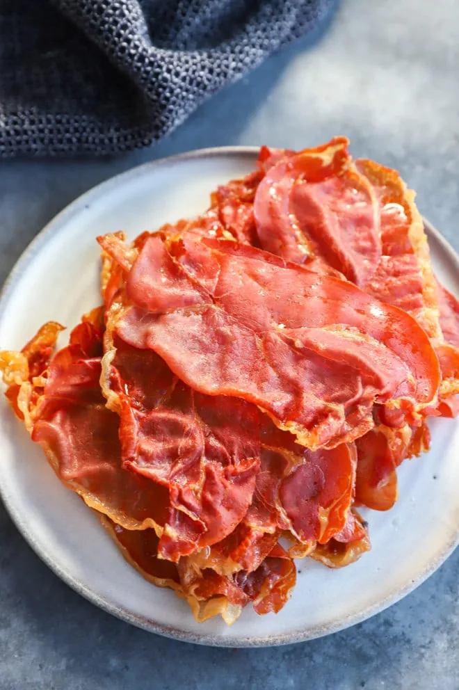 Plate of a baked snack thinly sliced ham