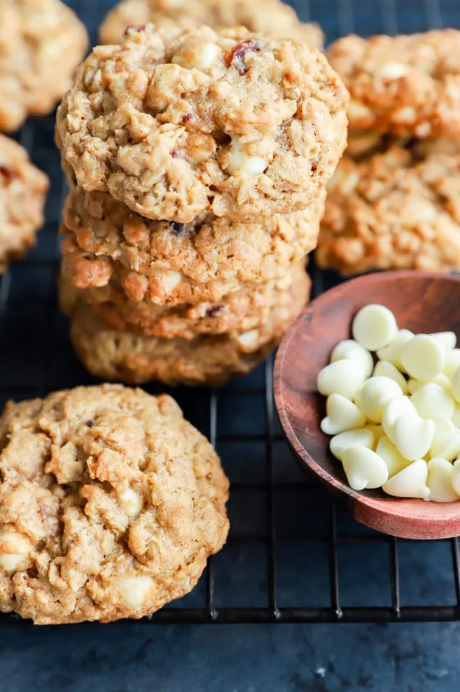 Homemade holiday treats in a stack with a bowl of chips