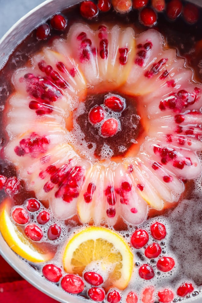 bowl of holiday drink with fresh fruit and ice ring