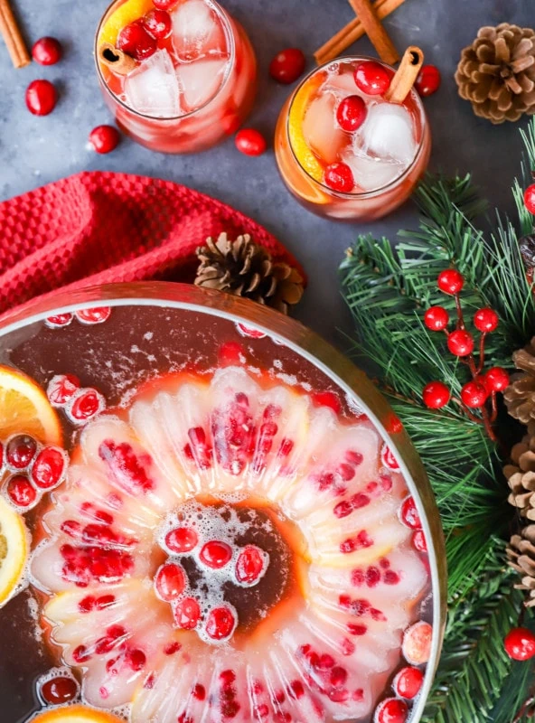 punch bowl with ice mold and cranberries and oranges