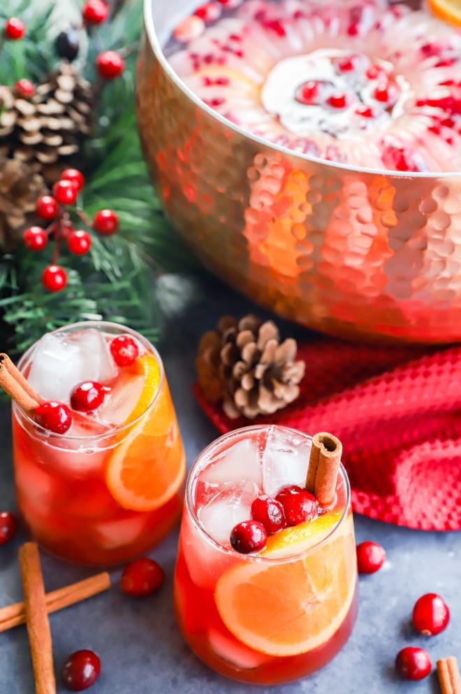 Christmas punch in glasses with cinnamon stick garnish