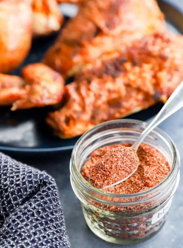 Grilled poultry on a plate with dry seasoning