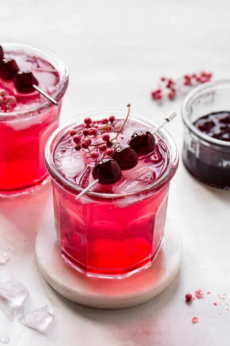 gin cocktail with cherries