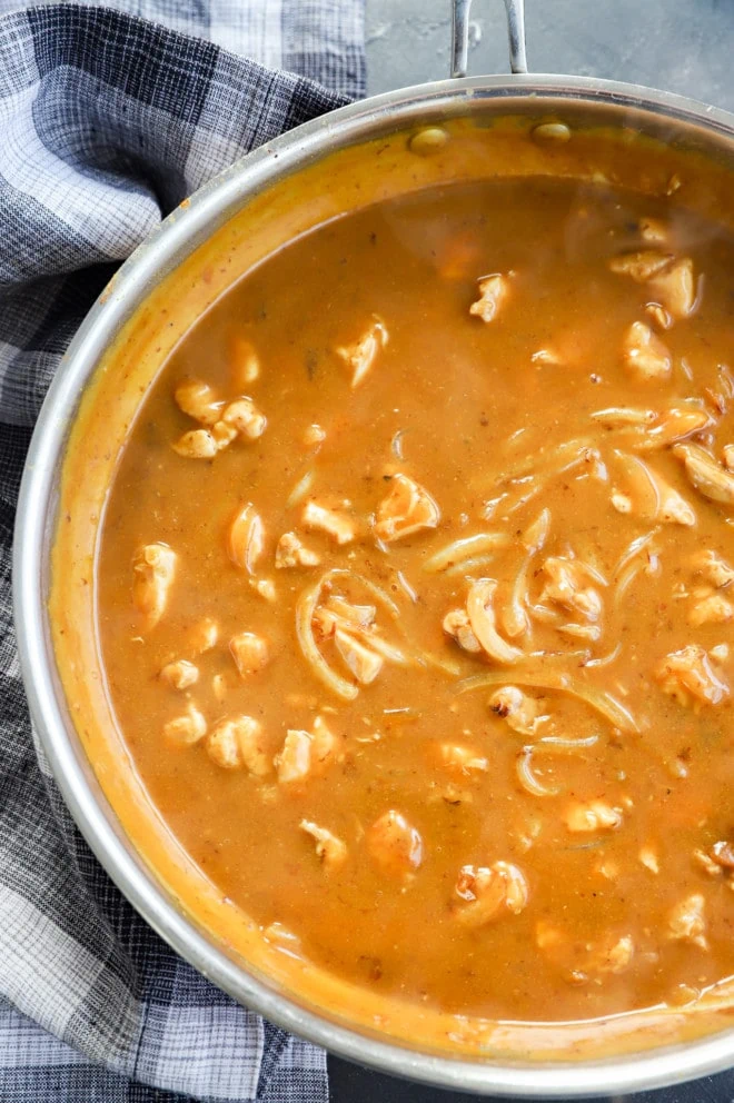 Making curry udon noodle sauce in a skillet