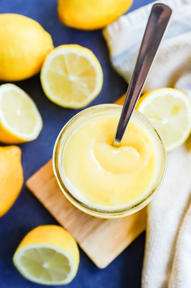 Image of mason jar with lemons and lemon curd with spoon
