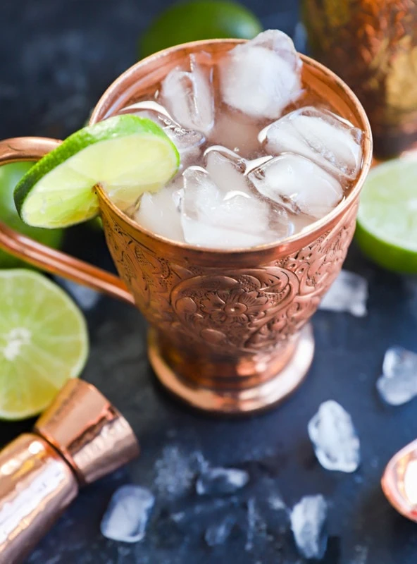 easy cocktail with ginger beer in mug with lime slice