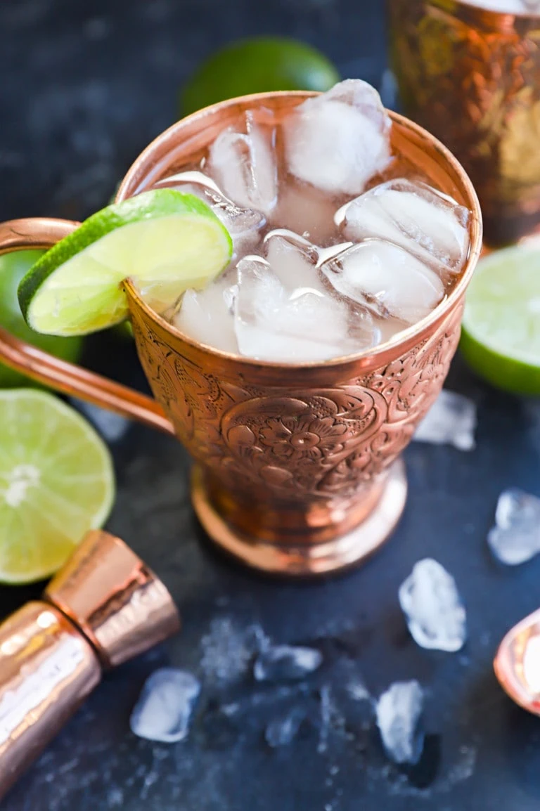 easy cocktail with ginger beer in mug with lime slice