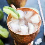 copper moscow mule mug with ginger beer and lime wheel