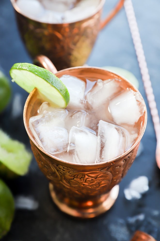 copper moscow mule mug with ginger beer and lime wheel