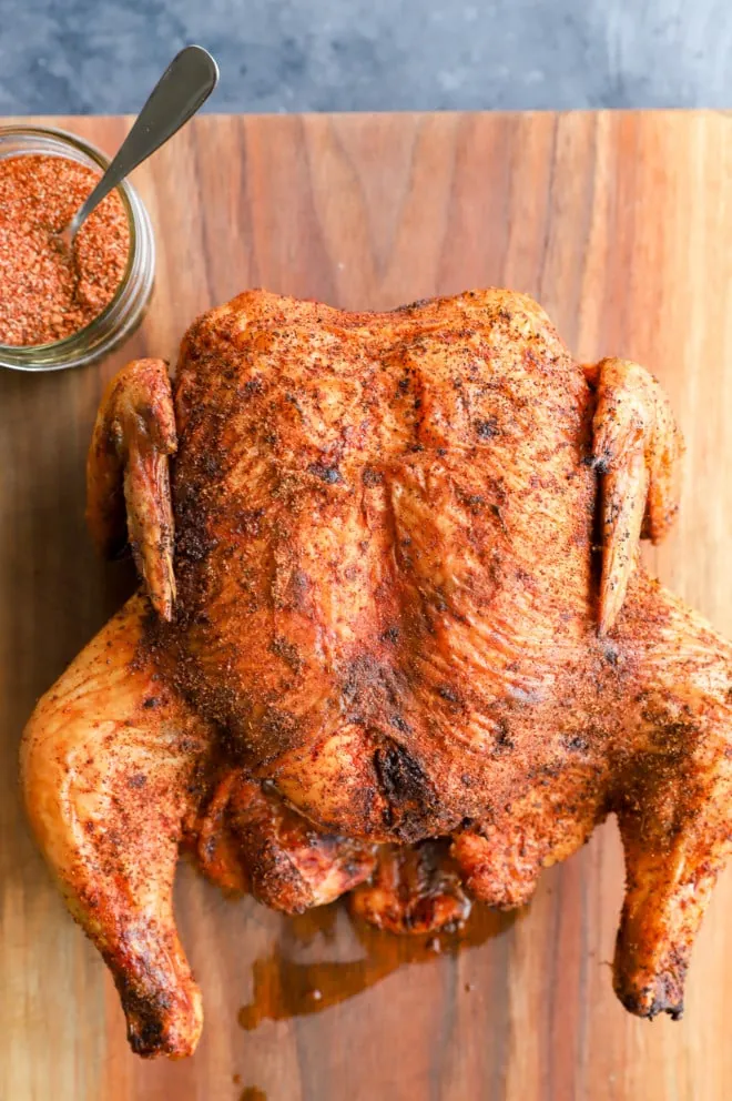 Bird on cutting board with dry rub