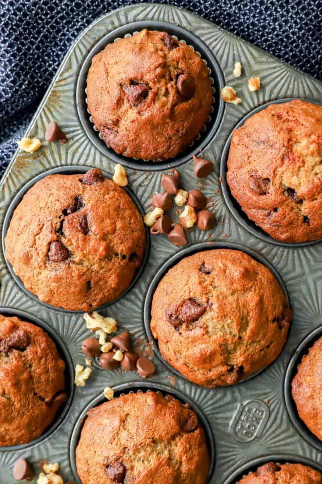 baked morning treats in cupcake tin with nuts and chocolate